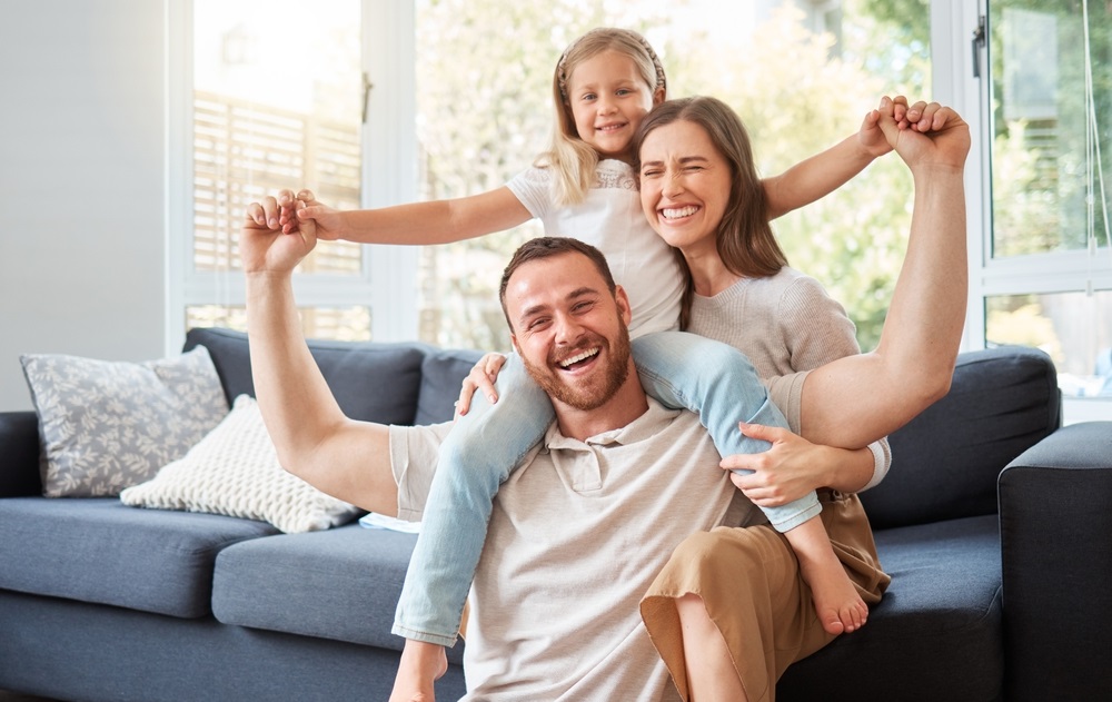 Father and daughter brushing teeth with bright smiles – Novato Dentist